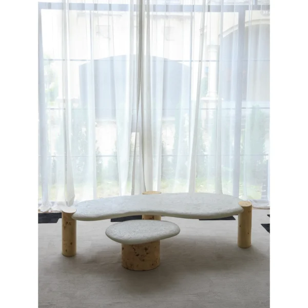 Organic White Stone Coffee Table Pair on Burl Cylinder Legs in ivory — in a room setting