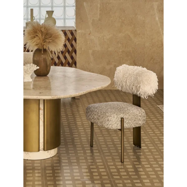 Free-Form Travertine Dining Table on Aged Brass Base in oatmeal — in a room setting
