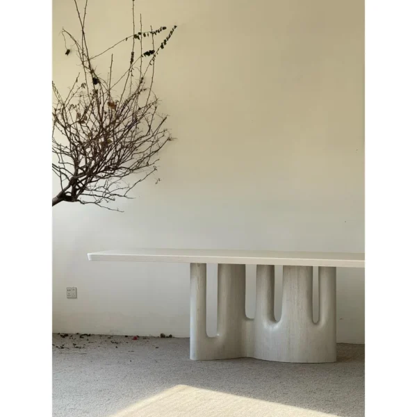 White Long Dining Table on Fluted Arch Base in ivory — in a room setting