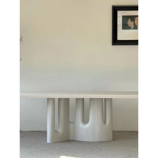 White Long Dining Table on Fluted Arch Base in ivory — in a room setting