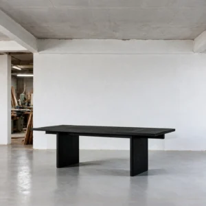 Otoko Black Ash Dining Table with Bridged Panel Legs in black — front view