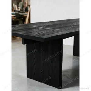 Otoko Black Ash Dining Table with Bridged Panel Legs in black — in a room setting