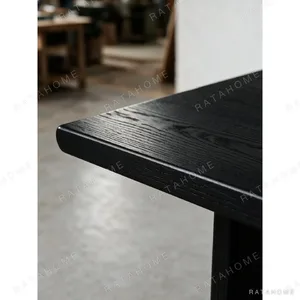 Otoko Black Ash Dining Table with Bridged Panel Legs in black — in a room setting