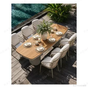 Outdoor Teak Top Dining Set in clay — in a room setting
