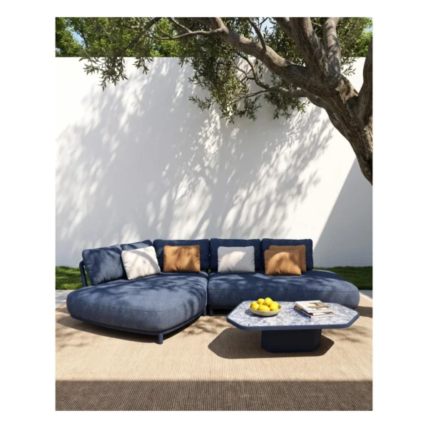 Outdoor L-Shaped Sofa in blue — in a room setting
