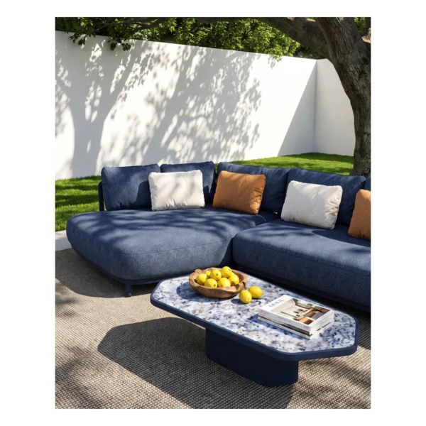 Outdoor L-Shaped Sofa in blue — in a room setting