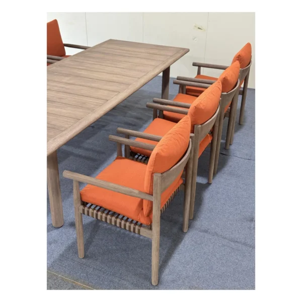 Lightweight Teak Outdoor Dining Set in natural oak — in a room setting