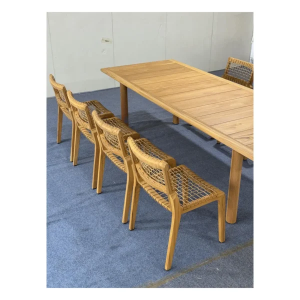 Lightweight Teak Outdoor Dining Set in natural oak — in a room setting