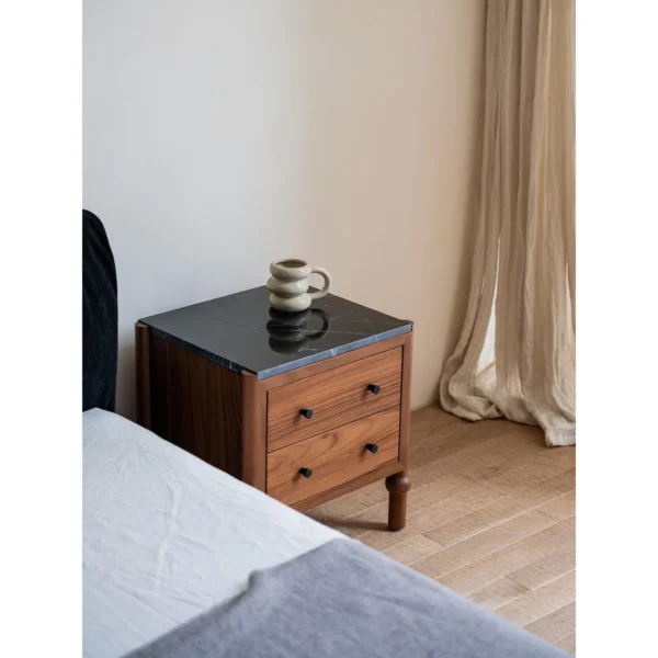 Panda Teak Nightstand with Stone Top and Ball Feet in clay — in a room setting