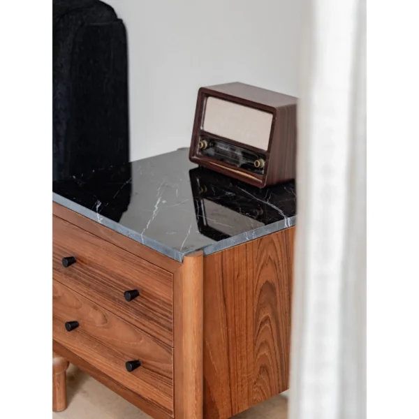Panda Teak Nightstand with Stone Top and Ball Feet in clay — in a room setting