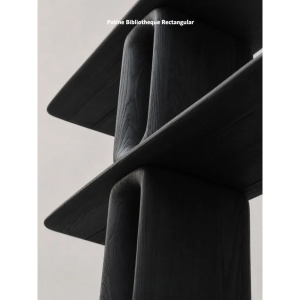 Dark Wood Open Bookcase with Oval Cut-Out Supports in black — in a room setting