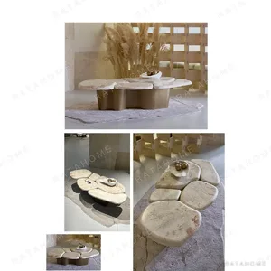 Pebble Landform Cream Marble Coffee Table Cluster in oatmeal — in a room setting