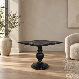 Inkstone Solid Wood Pedestal Table with Turned Old Wood Base in black — in a room setting