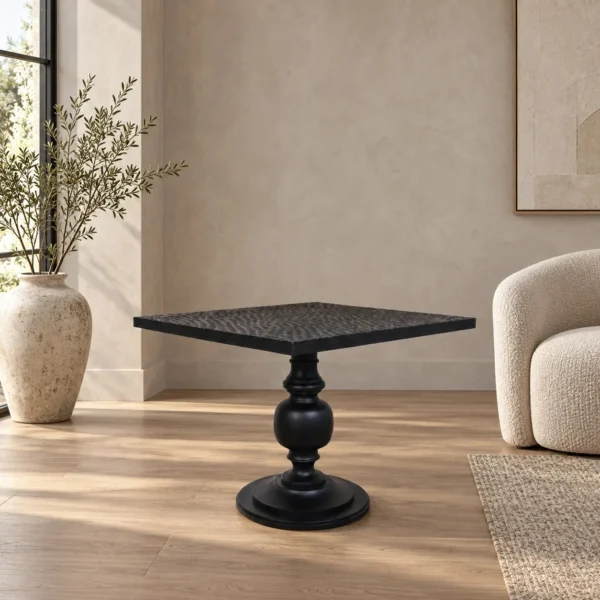 Inkstone Solid Wood Pedestal Table with Turned Old Wood Base in black — in a room setting