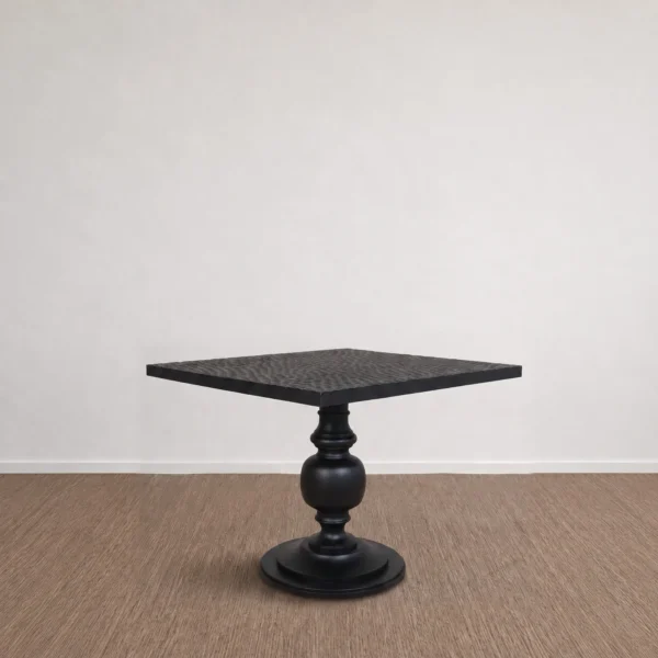 Inkstone Solid Wood Pedestal Table with Turned Old Wood Base in black — in a room setting
