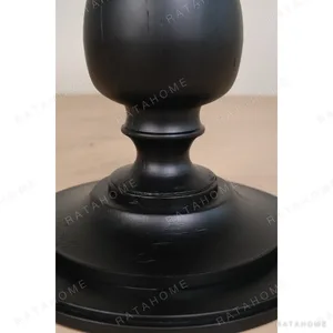 Inkstone Solid Wood Pedestal Table with Turned Old Wood Base in black — in a room setting