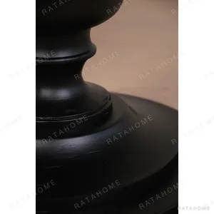 Inkstone Solid Wood Pedestal Table with Turned Old Wood Base in black — in a room setting