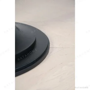 Inkstone Solid Wood Pedestal Table with Turned Old Wood Base in black — in a room setting