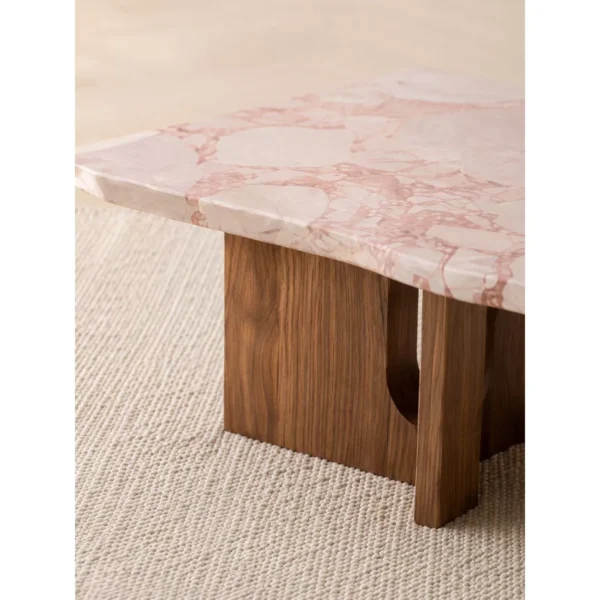 Pink Marble Square Coffee Table on Walnut Bridge Base in rose stone — in a room setting
