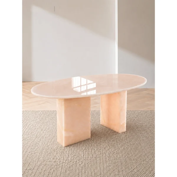 Pink Jade Oval Coffee Table with Gold Veining in rose stone — in a room setting
