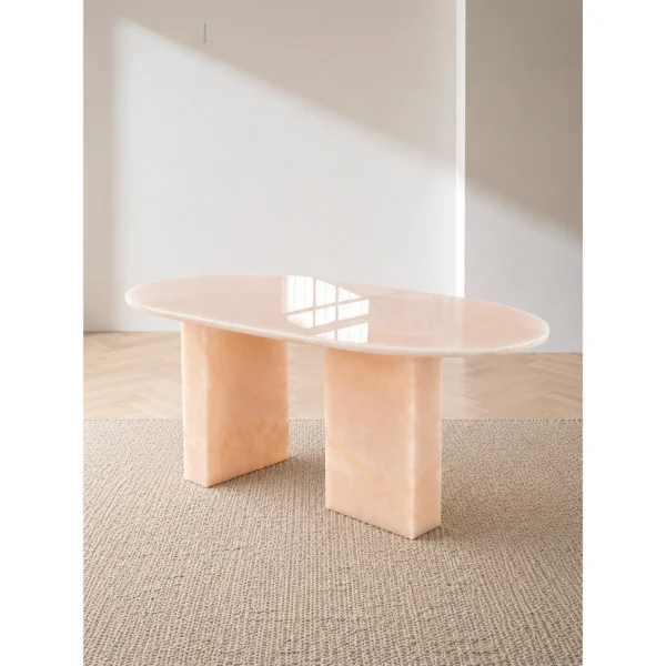 Pink Jade Oval Coffee Table with Gold Veining in rose stone — in a room setting