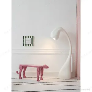Pink Leopard Sculptural Bench in rose stone — in a room setting