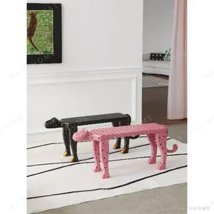 Pink Leopard Sculptural Bench in rose stone — in a room setting