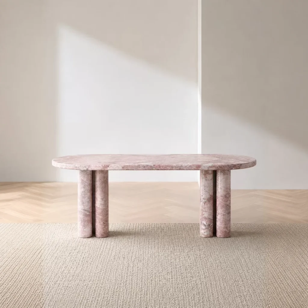 Pink-White Marble Oval Dining Table on Stone Cylinders in rose stone — front view