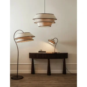 Pitman Arc Floor Lamp with Tiered Ivory Linen Shade in oatmeal — in a room setting