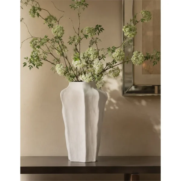 Designer Hand-Pinched Faceted Tall Ceramic Vase in ivory — in a room setting