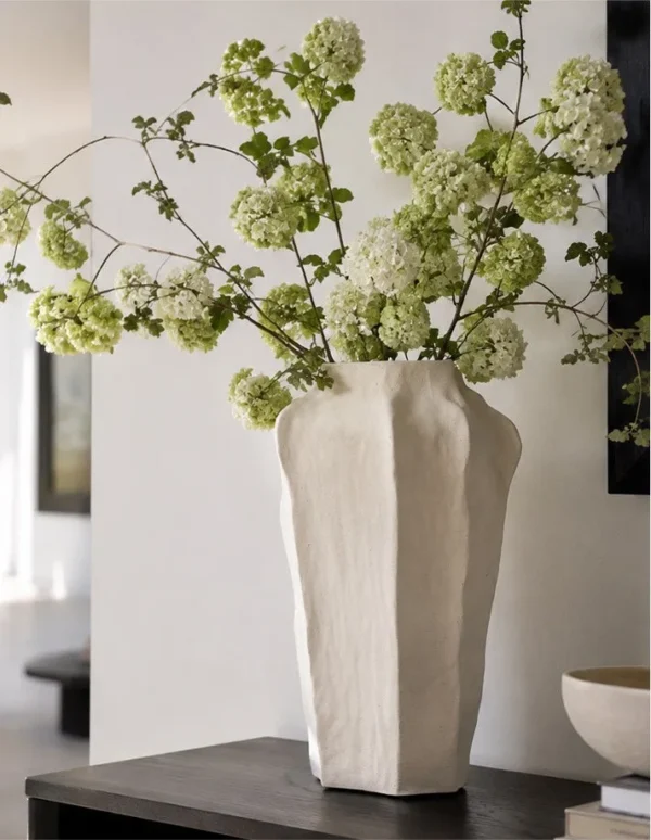 Designer Hand-Pinched Faceted Tall Ceramic Vase in ivory — in a room setting