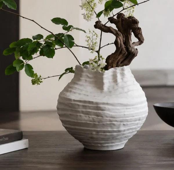 Plain White Layered Pleat Ceramic Vase with Torn Rim in ivory — in a room setting