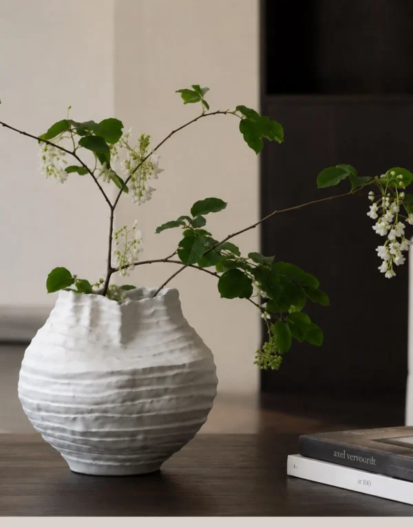Plain White Layered Pleat Ceramic Vase with Torn Rim in ivory — in a room setting