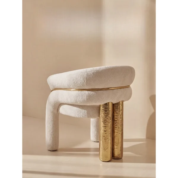 Vespera Cream Teddy Tub Chair with Gold Trim on Brass Legs in oatmeal — in a room setting