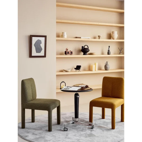 Plum Fully Upholstered Armless Chair in Olive Green — in a room setting