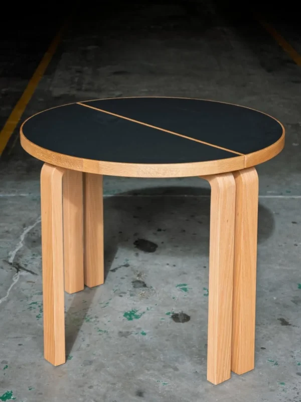 Two-Half Round Table with Black Top and Bentwood Legs in black — in a room setting
