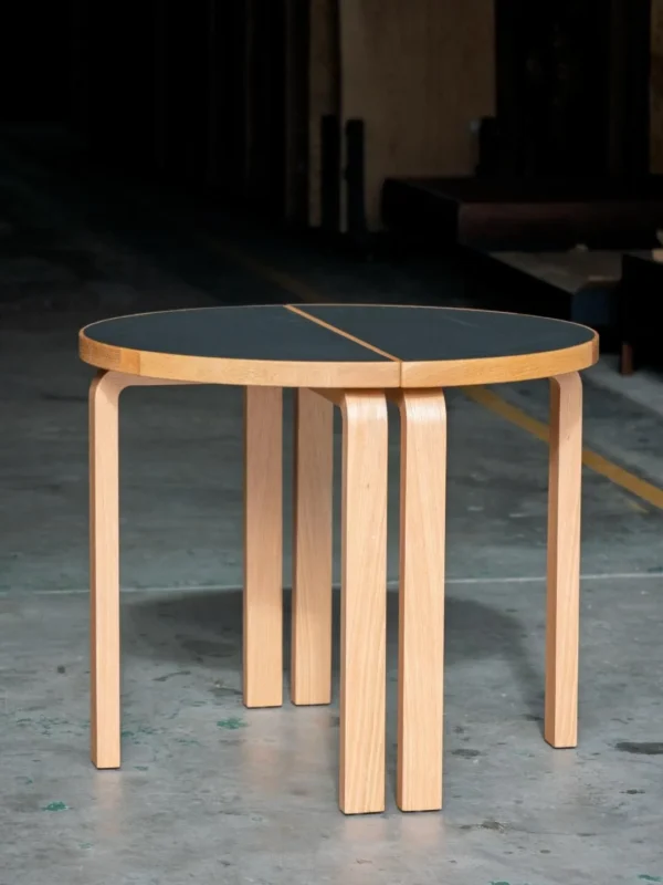Two-Half Round Table with Black Top and Bentwood Legs in black — in a room setting