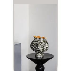 Polka Dot Textured Ceramic Vase with Orange Interior in oatmeal — in a room setting
