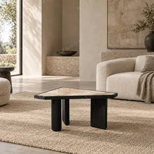 Polygonal Marble-Inset Low Table on Black Wood Legs in black — in a room setting