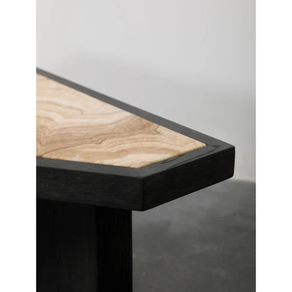 Polygonal Marble-Inset Low Table on Black Wood Legs in black — in a room setting