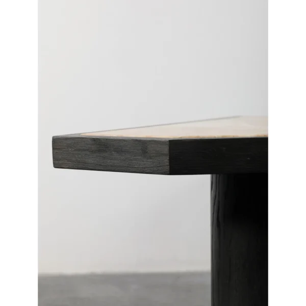 Polygonal Marble-Inset Low Table on Black Wood Legs in black — in a room setting