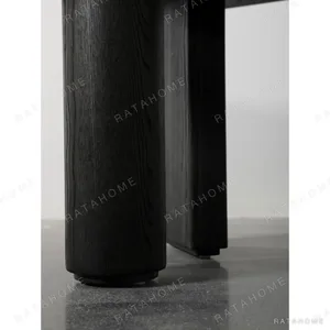 Polygonal Marble-Inset Low Table on Black Wood Legs in black — in a room setting