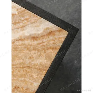 Polygonal Marble-Inset Low Table on Black Wood Legs in black — in a room setting