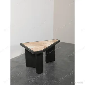 Polygonal Marble-Inset Low Table on Black Wood Legs in black — in a room setting