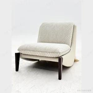 Ponytail Armless Lounge Chair in Cream Textured Fabric — in a room setting