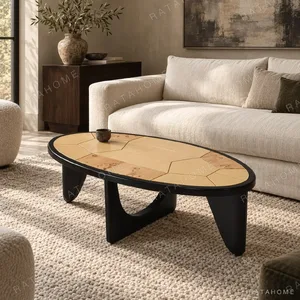 Round Poplar Burl Segmented Coffee Table on Black Beech Base in clay — in a room setting