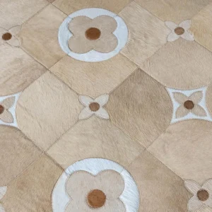 Premium Cowhide Rug with Circle Medallion Grid in Sand — in a room setting