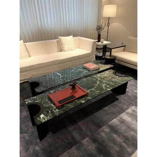 Green Marble Crescent Coffee Table Set with Black Arch Bases in olive — in a room setting