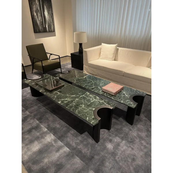 Green Marble Crescent Coffee Table Set with Black Arch Bases in olive — in a room setting