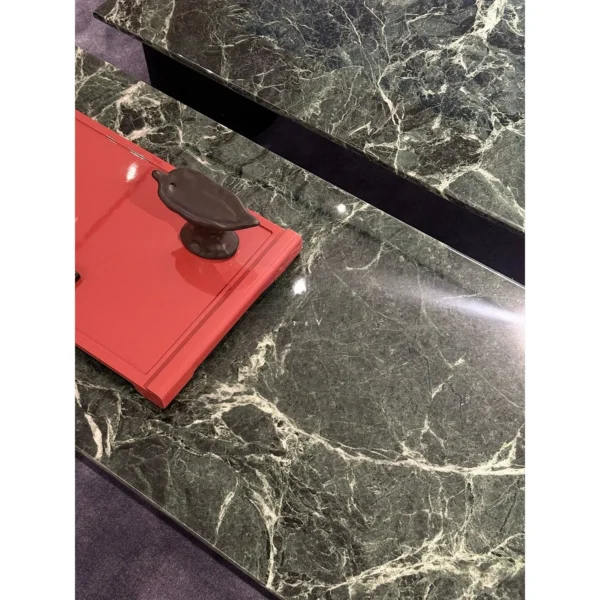 Green Marble Crescent Coffee Table Set with Black Arch Bases in olive — in a room setting